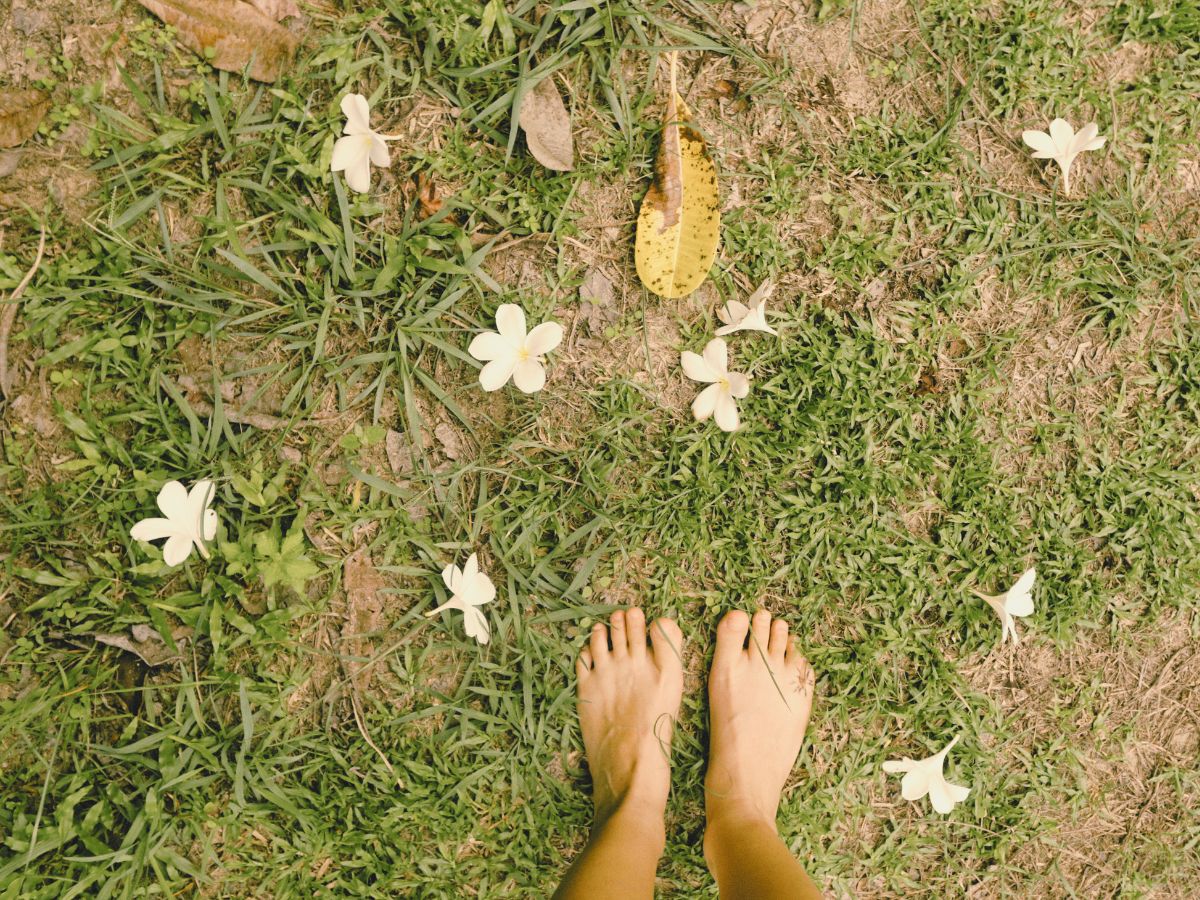 feet standing on the grass