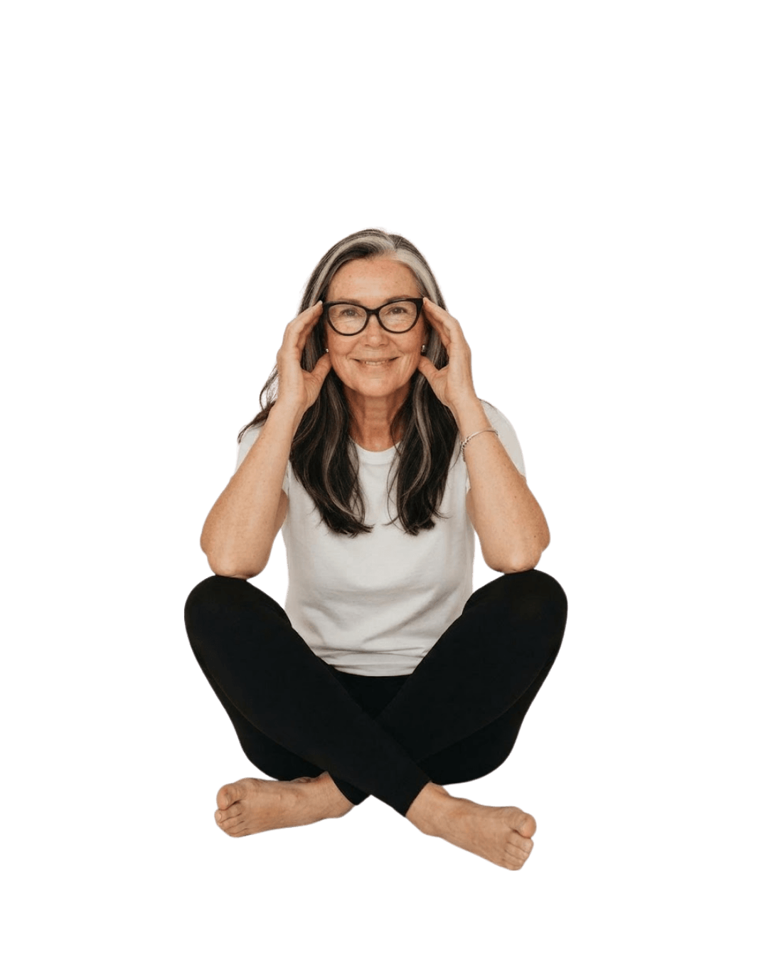 woman sitting cross legged and smiling